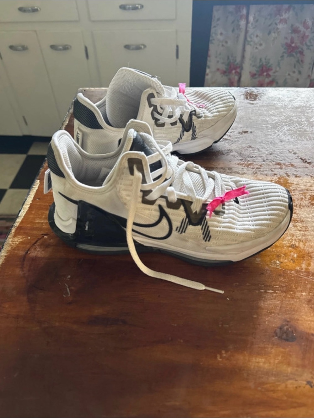 Nike Women’s White and Black Training Sneakers with Pink Accents
